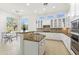 Spacious kitchen featuring ample counter space, white cabinetry, and stainless steel appliances at 5892 E Evening Glow Dr, Scottsdale, AZ 85266