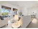 Open-concept living room featuring neutral colors and a view of the covered outdoor patio at 5892 E Evening Glow Dr, Scottsdale, AZ 85266