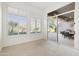Sunlit room with sliding glass doors to the outside patio and outdoor kitchen at 5892 E Evening Glow Dr, Scottsdale, AZ 85266
