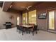 Covered patio featuring a dining table, grill, and outdoor television, perfect for entertaining at 5892 E Evening Glow Dr, Scottsdale, AZ 85266