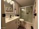Bathroom featuring a vanity with storage and a glass-enclosed shower at 6161 S Pinehurst Dr, Chandler, AZ 85249