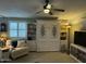 Cozy living room featuring a murphy bed, comfortable armchair, and ample shelving at 6161 S Pinehurst Dr, Chandler, AZ 85249