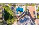 Aerial view of backyard oasis with pool, spa, gazebo, green grass and desert landscaping at 6576 W Lone Cactus Dr, Glendale, AZ 85308