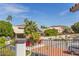 Balcony view showcasing flowering plants, desert foliage, neighboring houses, and beautiful mountain views at 6576 W Lone Cactus Dr, Glendale, AZ 85308