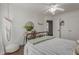 Bright bedroom with modern furnishings and a ceiling fan at 6576 W Lone Cactus Dr, Glendale, AZ 85308