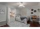 Cozy bedroom showcasing a comfortable bed, bright window, and stylish decor at 6576 W Lone Cactus Dr, Glendale, AZ 85308