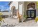 Covered entryway, leading to double doors with glass, featuring decor at 6576 W Lone Cactus Dr, Glendale, AZ 85308