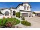 A beautifully landscaped front yard leads up to this stunning home at 6576 W Lone Cactus Dr, Glendale, AZ 85308