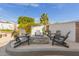 Inviting outdoor space with a stylish firepit surrounded by comfortable Adirondack chairs at 6576 W Lone Cactus Dr, Glendale, AZ 85308