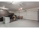 Organized garage showcasing ample space for vehicles and storage, with a clean and epoxy-coated floor at 6576 W Lone Cactus Dr, Glendale, AZ 85308