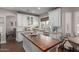 Bright, inviting kitchen features an island and views into the dining area at 6576 W Lone Cactus Dr, Glendale, AZ 85308