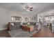 Living room with a comfortable sofa and view to the kitchen at 6576 W Lone Cactus Dr, Glendale, AZ 85308