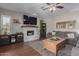 A spacious living room features a fireplace and comfortable seating at 6576 W Lone Cactus Dr, Glendale, AZ 85308