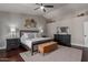 This bedroom features a ceiling fan, rug, and dark wood furniture at 6576 W Lone Cactus Dr, Glendale, AZ 85308