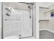 Modern bathroom features a glass-enclosed shower with shelving and access to the walk-in closet at 7006 E Jensen St # 33, Mesa, AZ 85207