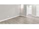Cozy bedroom features wood-look tile flooring and a large window at 7006 E Jensen St # 33, Mesa, AZ 85207