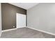 Bedroom showcasing a two-tone paint design, wood-look tile, and sliding-door closet at 7006 E Jensen St # 33, Mesa, AZ 85207
