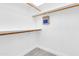 Walk-in closet with built-in shelving and wood-look tile flooring at 7006 E Jensen St # 33, Mesa, AZ 85207