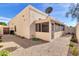 Beige home featuring a desert landscaped yard and a screened porch addition at 7006 E Jensen St # 33, Mesa, AZ 85207