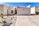 Charming single-story home with a two-car garage and desert landscaping at 7006 E Jensen St # 33, Mesa, AZ 85207