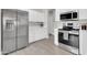 Modern kitchen featuring stainless steel appliances and white cabinetry at 7006 E Jensen St # 33, Mesa, AZ 85207