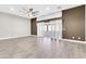 Bright living room with wood-look tile flooring, a modern ceiling fan, and a sliding glass door to the outdoors at 7006 E Jensen St # 33, Mesa, AZ 85207