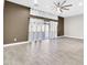 Bright, airy living room with sliding glass door to patio, wood-look tile floor and modern ceiling fan at 7006 E Jensen St # 33, Mesa, AZ 85207