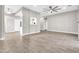 Open living room features wood tile flooring, neutral paint, and recessed lighting at 7006 E Jensen St # 33, Mesa, AZ 85207