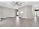 Spacious living room with wood-look tile, gray walls, recessed lighting and a ceiling fan at 7006 E Jensen St # 33, Mesa, AZ 85207