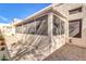 Screened-in patio with gravel flooring, a ceiling fan, and plenty of natural light at 7006 E Jensen St # 33, Mesa, AZ 85207
