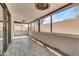 Spacious screened porch features tile flooring, natural lighting, and a ceiling fan at 7006 E Jensen St # 33, Mesa, AZ 85207