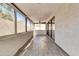Screened in porch featuring tile flooring, many windows, and a ceiling fan at 7006 E Jensen St # 33, Mesa, AZ 85207
