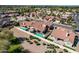Aerial view of a home showcasing a pool, covered patio, desert landscaping, and fenced yard in a residential area at 751 W Elgin St, Chandler, AZ 85225