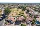 An aerial view highlighting beautiful homes with private pools, well-manicured lawns, and proximity to a park at 751 W Elgin St, Chandler, AZ 85225
