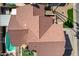 A tile roof atop a beautifully crafted home with a backyard retreat, including a refreshing pool and a patio area at 751 W Elgin St, Chandler, AZ 85225