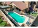 The backyard has a sparkling pool, a relaxing seating area, and a well-manicured space for relaxation and enjoyment at 751 W Elgin St, Chandler, AZ 85225