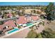 Aerial view of homes with tile roofs, lush landscaping, pools, and park access at 751 W Elgin St, Chandler, AZ 85225