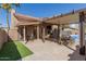 An inviting backyard patio with an extended covered area and an outdoor dining set, perfect for entertaining at 751 W Elgin St, Chandler, AZ 85225