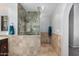 Modern bathroom featuring a glass shower with tiled walls and neutral-toned tiles along the walls and floors at 751 W Elgin St, Chandler, AZ 85225