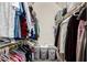 Walk-in closet with ample storage, clothing racks, and built-in shelving for optimal organization and convenience at 751 W Elgin St, Chandler, AZ 85225