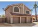 Two-story home showcasing a three-car garage, desert landscaping, and a red tile roof at 751 W Elgin St, Chandler, AZ 85225