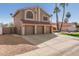 Two-story home showcasing a three-car garage, desert landscaping, and a red tile roof at 751 W Elgin St, Chandler, AZ 85225