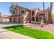 Two-story home showcasing a three-car garage and desert landscaping at 751 W Elgin St, Chandler, AZ 85225