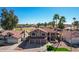 A charming two-story home with a three car garage, a tile roof, and a well-manicured front yard at 751 W Elgin St, Chandler, AZ 85225