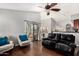Spacious living room with hardwood floors, a view to the kitchen and a sliding glass door at 751 W Elgin St, Chandler, AZ 85225