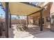 Covered patio with a wooden table, metal chairs, and tiled floor at 751 W Elgin St, Chandler, AZ 85225