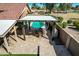 A beautiful outdoor patio with a dining table, grill, and bar area overlooking the pool at 751 W Elgin St, Chandler, AZ 85225