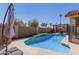 Pool featuring bright blue water, artificial turf, and outdoor dining area at 751 W Elgin St, Chandler, AZ 85225