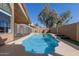 A refreshing backyard swimming pool with a safety fence and a clear blue water, ideal for relaxation and recreation at 751 W Elgin St, Chandler, AZ 85225