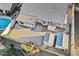 Aerial view of the property with a pool, two outbuildings, and landscaped backyard at 7538 E Forge Ave, Mesa, AZ 85208